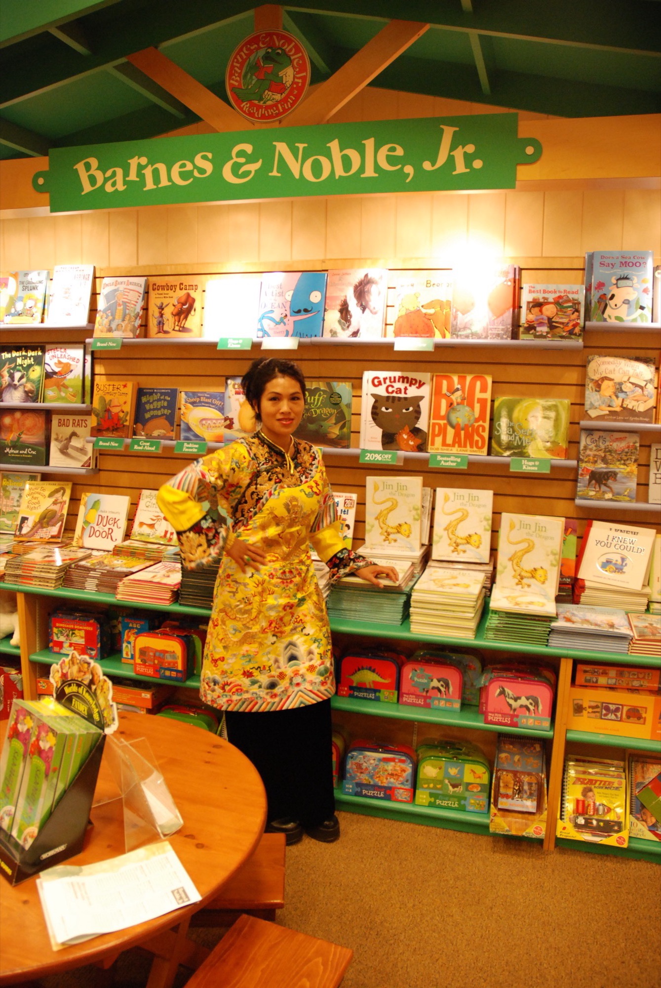 Grace Chang standing before her books at Barnes and Noble Jr.